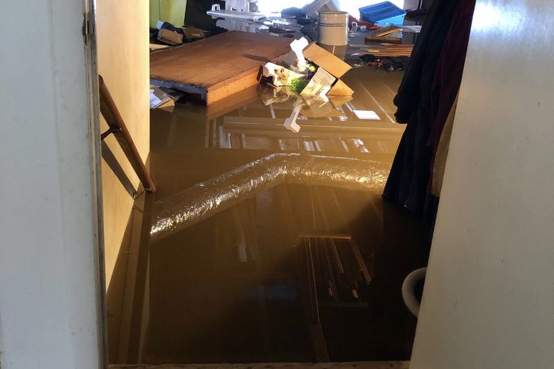 Basement with standing water after weeks of heavy rain